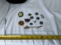 Front view of all jewellery items with measuring tape for scale