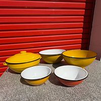 All five enamel bowls grouped for size and color comparison