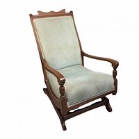 Front angled view of Eastlake style glider rocker