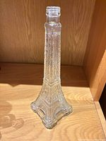 Front view of clear glass Eiffel Tower bottle