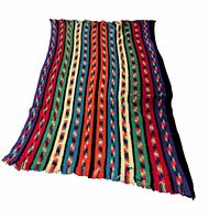 Full view of crocheted afghan showing overall striped pattern and fringe