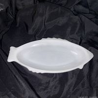 Top view of white fish-shaped milk glass baking dish