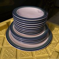 Stacked view of all plates emphasizing count and rim design