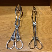 Front view of both serving tongs side by side