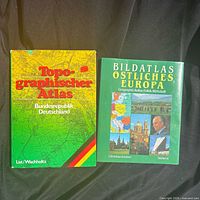 Front covers of both atlases