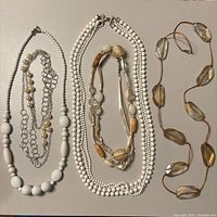 All five necklaces laid flat for full lot view
