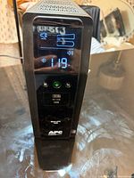 Front view of APC BR1500MS2 UPS showing LCD display and USB ports