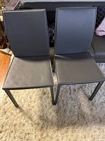 Front view of both grey dining chairs