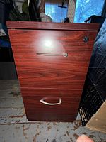 Front view showing two drawers, handles and lock
