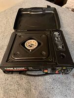 Full view of Cook Stone portable stove with lid open