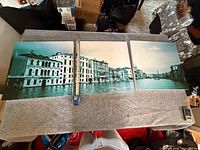 Full view of three panels laid out with measuring tape for scale