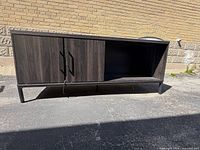 Front view showing doors, open compartment, metal base
