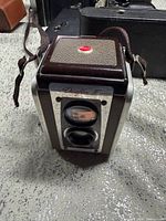 Front view showing twin lenses, Duaflex IV nameplate, strap