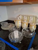 Overall lot showing canisters, trays, crystal pieces