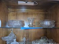 Shelf view showing open bowl, bud vase, covered dish