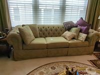 Front view of Ethan Allen tufted sofa with pillows