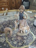 Overall view of Lladro figurine and separate bird figurine