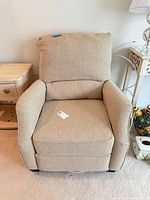 Front view of beige recliner chair