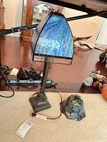 Full lamp with primary shade and extra shade on floor