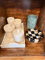 Full lot showing tray with four beige marble pieces, green tumbler, onyx ashtray