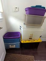 Stack of six plastic bins showing sizes and colors