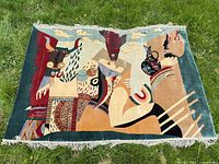 Full view of wool area rug laid flat showing complete pattern and fringe