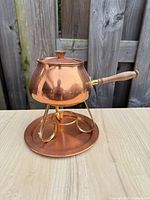 Copper fondue pot on brass stand with drip tray