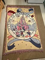 Full view of woven Disney 25th anniversary throw blanket