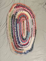 Full view of oval multicolor crochet rug