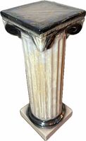 Full view of iridescent ceramic Ionic column pedestal showing color, fluting, and scrolled capital