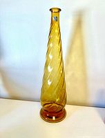 Full view of amber swirl glass vase