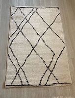 Rug fully unrolled showing geometric diamond pattern