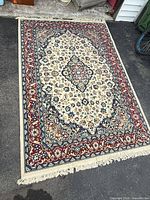 Full view of rug showing overall design and fringe