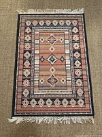 Overhead view showing full rug, fringe, and dimensions context