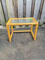 Full view of rattan and glass side table