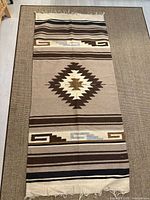 Full view of the runner showing overall design and fringe