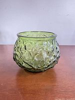 Front view of green crinkle glass footed planter