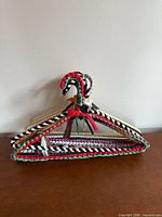 Front view showing multicolor braided hangers stacked