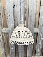 Front view of wicker rattan pendant lamp hanging