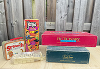 Group shot of all game boxes and domino set