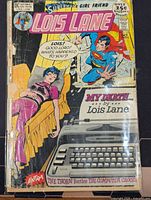 Front cover of Lois Lane #115 comic showing title, artwork, price, taped spine, wear