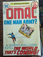 Front cover of OMAC Issue #1 showing title, price, DC logo, and artwork