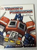 Front cover showing title, author Simon Furman, DK logo, Optimus Prime artwork