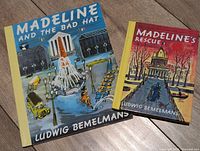 Front covers of both Madeline hardcovers on wood floor