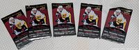 Five sealed Tim Hortons NHL trading card packs displayed front side up