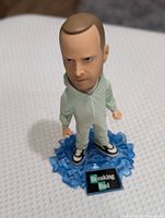 Front view of Breaking Bad bobblehead on blue crystal base