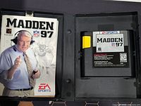 Open case showing cartridge and manual