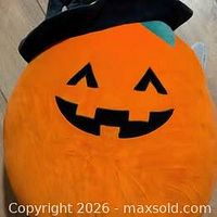 Front view of Paige jack-o-lantern Squishmallow plush