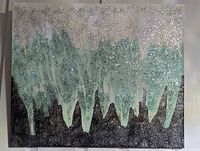 Full view of abstract green, black and speckled painting on canvas