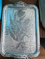 Top view of hammered aluminum Rodney Kent tray showing full design